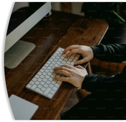 person typing on a keyboard